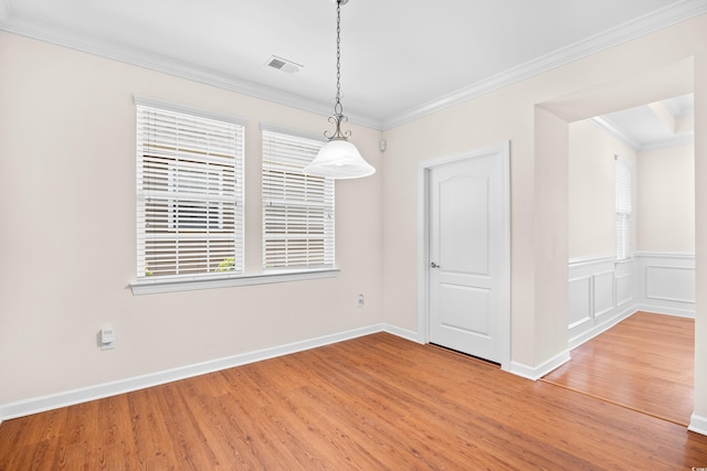 1537 Beaumont Way, Myrtle Beach, SC 29577 - unfurnished dining area featuring light wood-style floors, healthy amount of natural light, ornamental molding, baseboards, and wainscoting