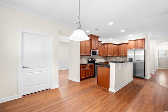 1537 Beaumont Way, Myrtle Beach, SC 29577 - kitchen with stainless steel appliances, ornamental molding, dark countertops, wood finished floors, and recessed lighting