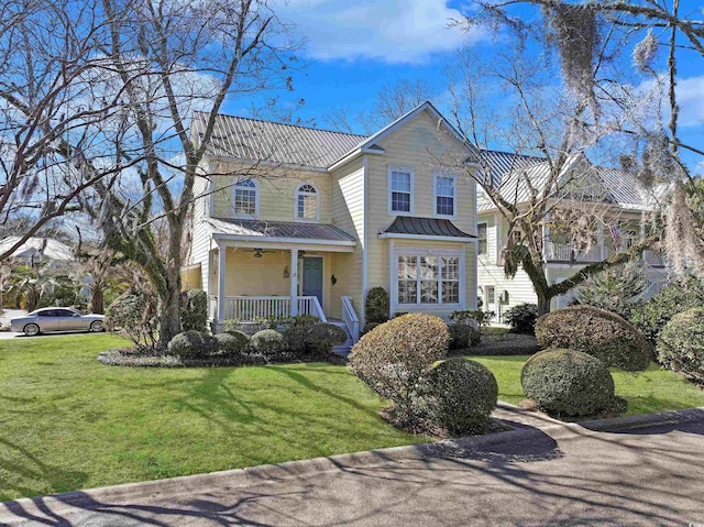 front of property with a front yard and a porch