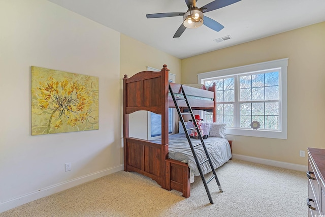 bedroom featuring light carpet and ceiling fan