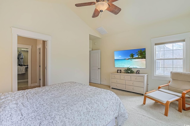 bedroom with light carpet, high vaulted ceiling, and ceiling fan