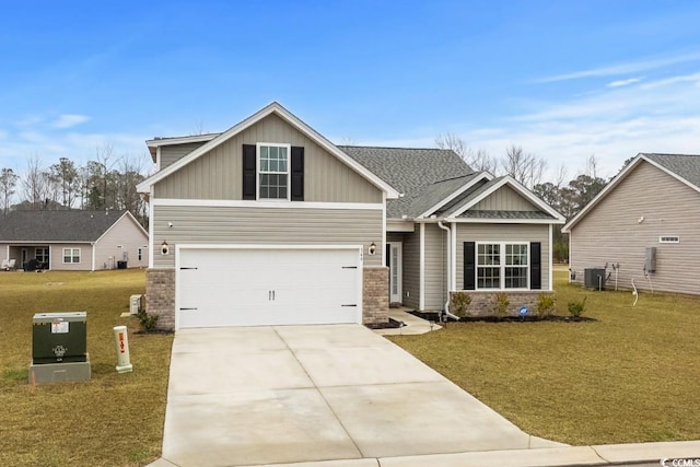 craftsman inspired home featuring driveway, brick siding, a front yard, and cooling unit