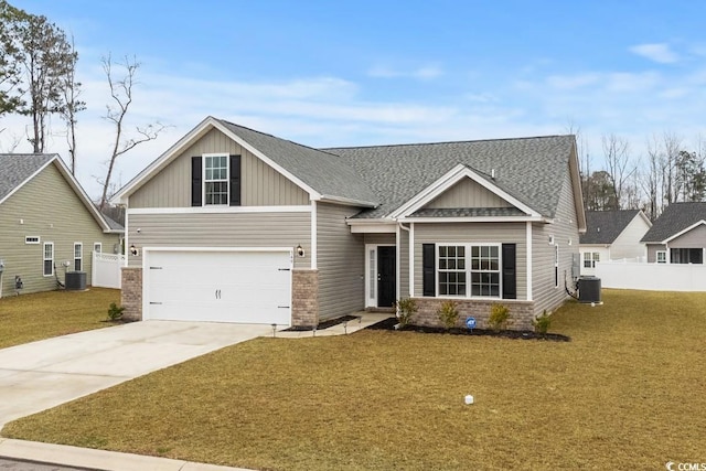 craftsman house with driveway, brick siding, central AC, and a front yard