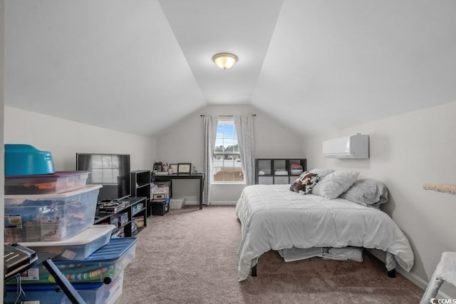 carpeted bedroom featuring an AC wall unit, vaulted ceiling, and baseboards