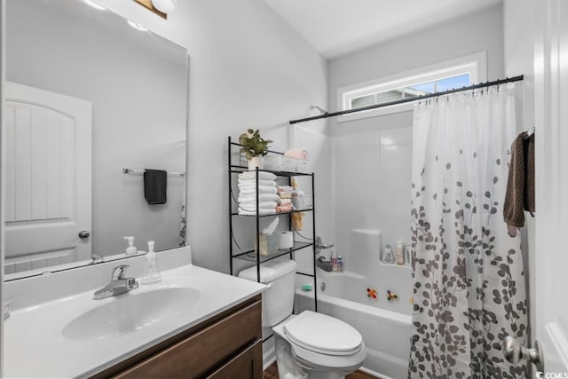 full bathroom featuring shower / bath combination with curtain, vanity, and toilet