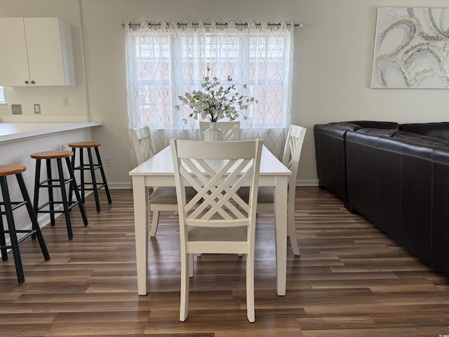 3955 Gladiola Ct Unit 301, Myrtle Beach, SC 29588 - dining space with dark wood-style flooring, healthy amount of natural light, and baseboards