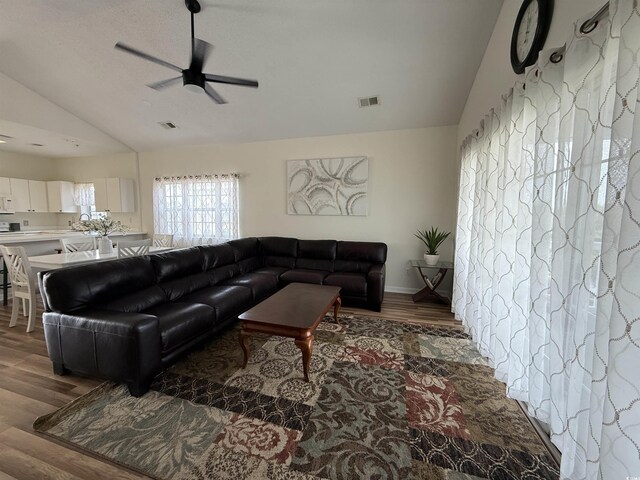 3955 Gladiola Ct Unit 301, Myrtle Beach, SC 29588 - living area featuring wood finished floors, a ceiling fan, high vaulted ceiling, and baseboards
