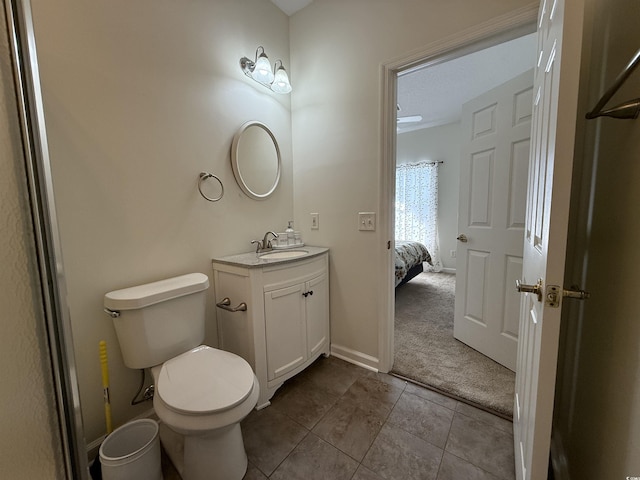 3955 Gladiola Ct Unit 301, Myrtle Beach, SC 29588 - ensuite bathroom with toilet, tile patterned floors, vanity, and baseboards