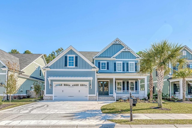 craftsman-style home with a porch and a garage