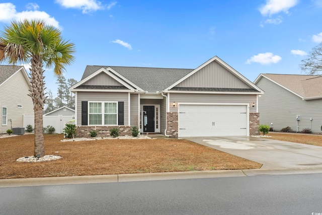 craftsman-style house featuring a garage and central AC