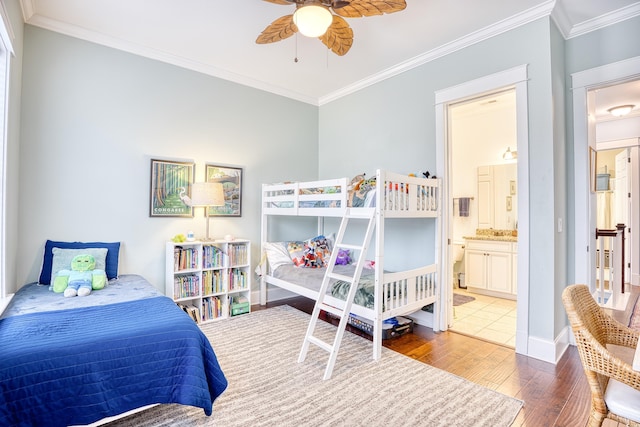 843 Howard Ave, Myrtle Beach, SC 29577 - bedroom with wood-type flooring, crown molding, and connected bathroom