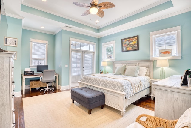 843 Howard Ave, Myrtle Beach, SC 29577 - bedroom with a raised ceiling, hardwood / wood-style floors, a desk, multiple windows, and ornamental molding