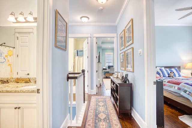 843 Howard Ave, Myrtle Beach, SC 29577 - hallway featuring dark wood-style flooring, ornamental molding, and an upstairs landing