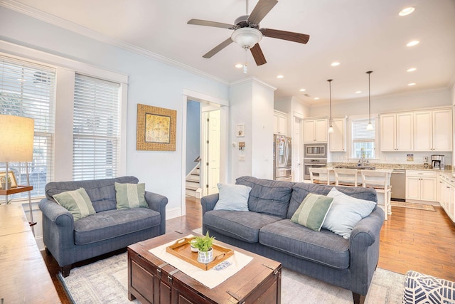 843 Howard Ave, Myrtle Beach, SC 29577 - living area featuring light wood finished floors, crown molding, a ceiling fan, stairs, and recessed lighting