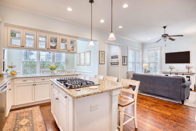 843 Howard Ave, Myrtle Beach, SC 29577 - kitchen with stainless steel appliances, a kitchen bar, crown molding, dark wood finished floors, and light stone counters