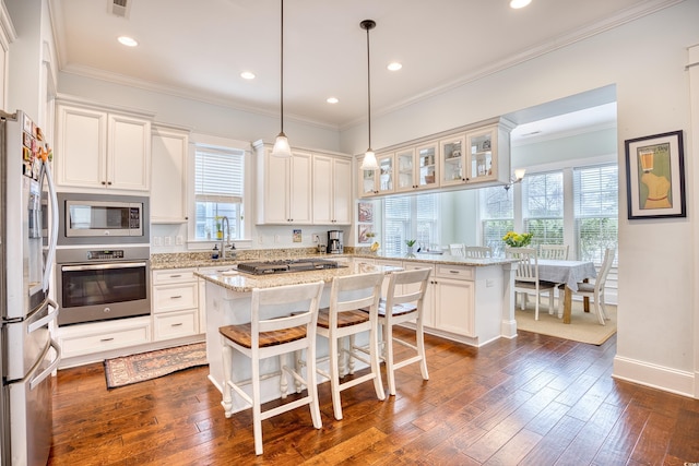 843 Howard Ave, Myrtle Beach, SC 29577 - kitchen with stainless steel appliances, a peninsula, white cabinetry, dark wood-style floors, and recessed lighting