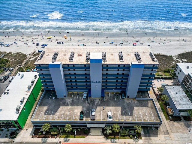 aerial view with a water view and a view of the beach