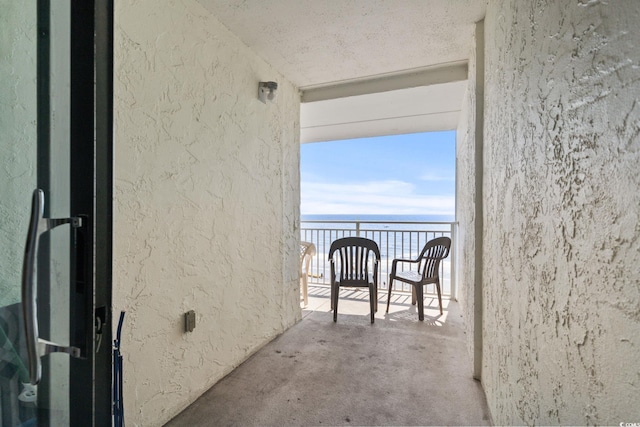 balcony featuring a water view