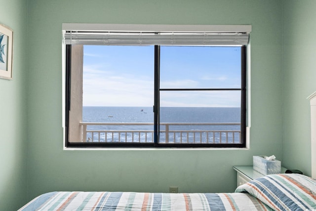 unfurnished bedroom with a water view