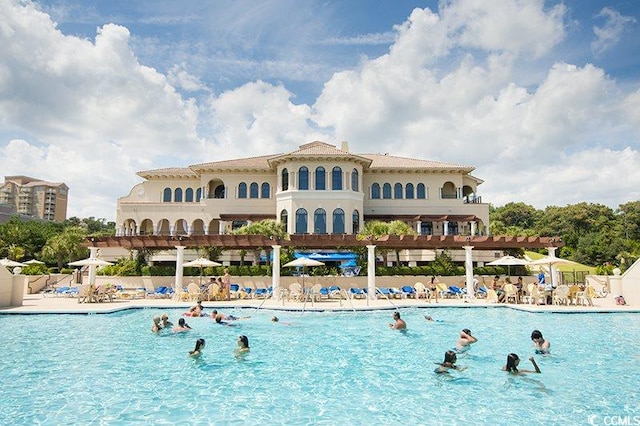 view of swimming pool featuring a pergola