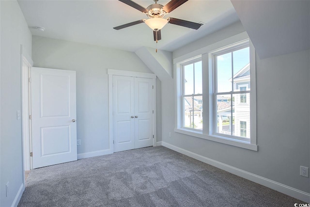 unfurnished bedroom featuring ceiling fan and carpet flooring