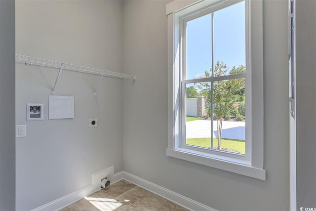 washroom with hookup for an electric dryer