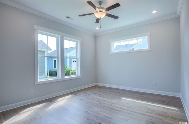 empty room with crown molding, light hardwood / wood-style floors, and ceiling fan