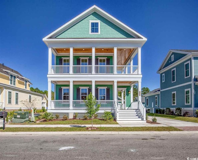 view of front of house featuring a balcony and covered porch