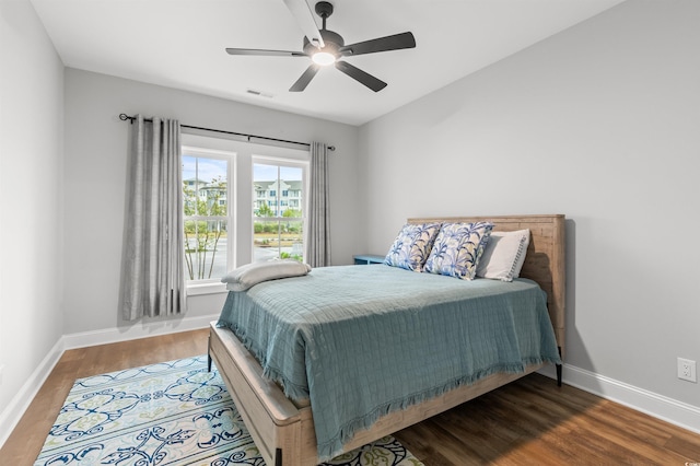 bedroom featuring hardwood / wood-style flooring and ceiling fan