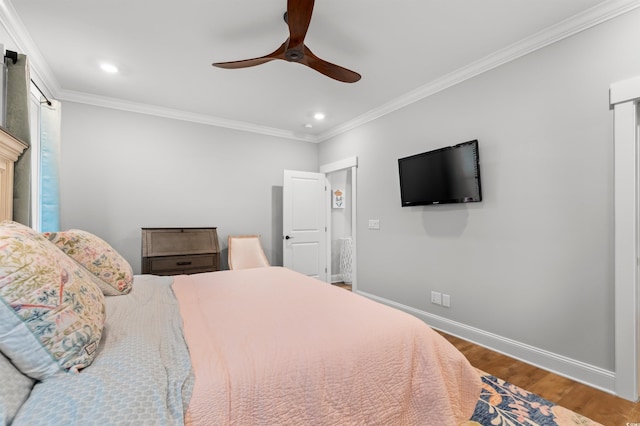 bedroom featuring hardwood / wood-style floors, crown molding, and ceiling fan