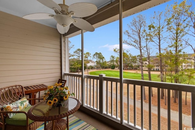 balcony featuring ceiling fan