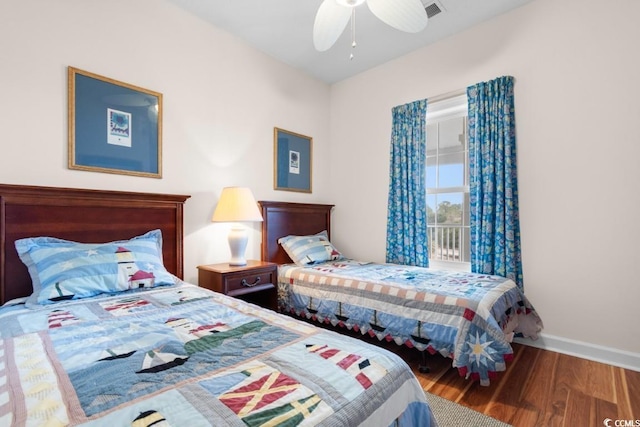 bedroom featuring wood-type flooring and ceiling fan