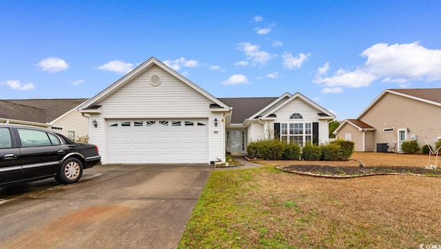 single story home featuring a garage, a front yard, and concrete driveway