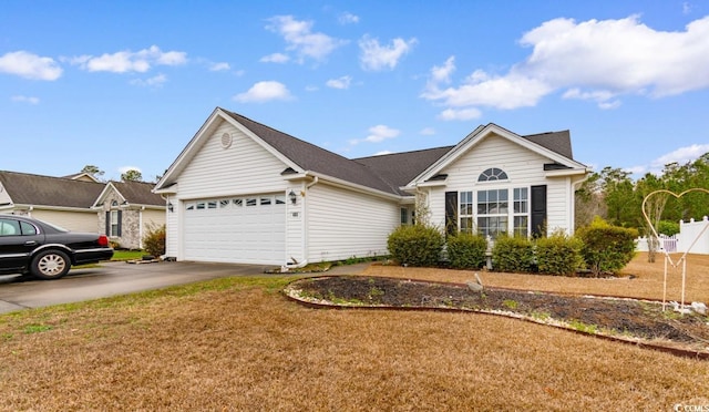 ranch-style home featuring a garage, a front yard, and concrete driveway