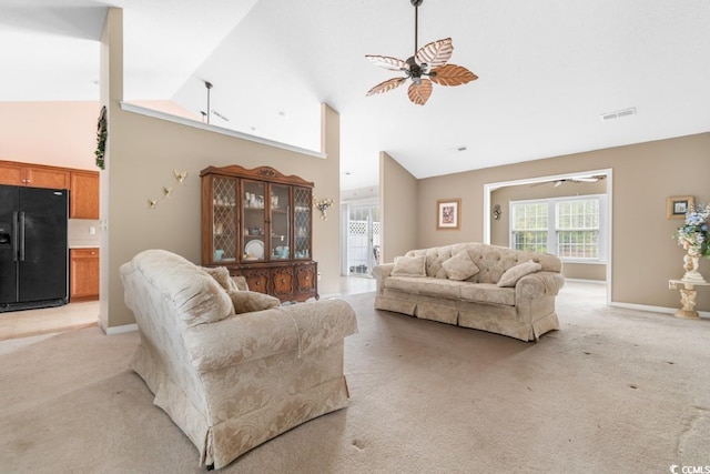 living area featuring light carpet, ceiling fan, and visible vents