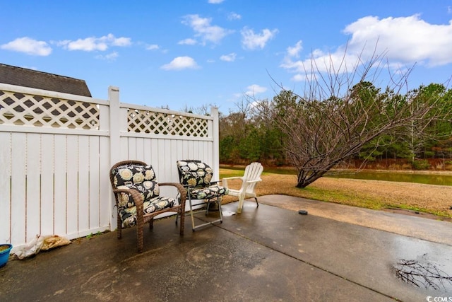 view of patio / terrace featuring fence