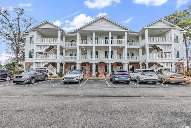 view of property featuring uncovered parking