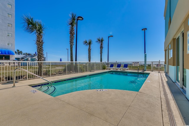 view of pool featuring a patio area