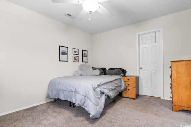 bedroom featuring light carpet and ceiling fan