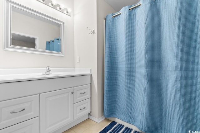 bathroom featuring tile patterned floors, a shower with shower curtain, and vanity