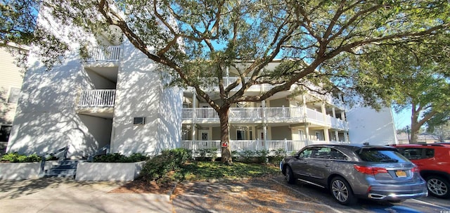 view of property featuring uncovered parking