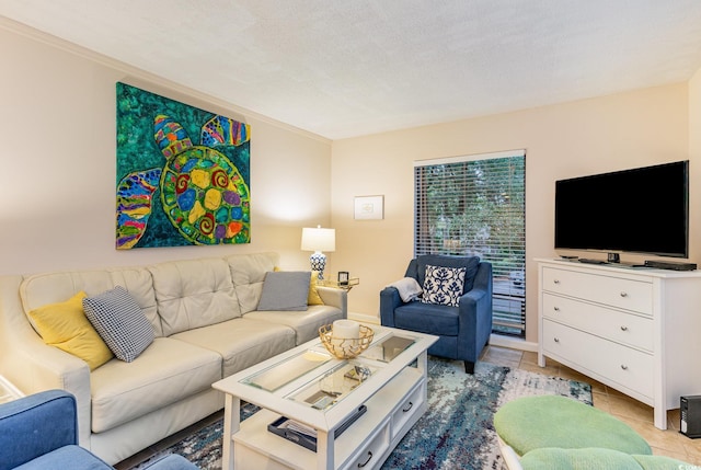 living room featuring light tile patterned flooring and a textured ceiling