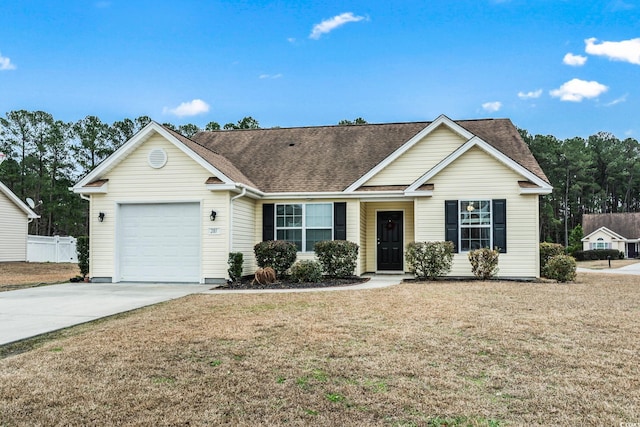 ranch-style home with a garage and a front yard