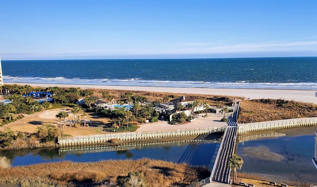 bird's eye view with a water view and a view of the beach