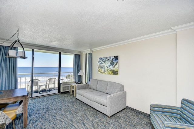 living room with ornamental molding, floor to ceiling windows, a water view, and dark carpet