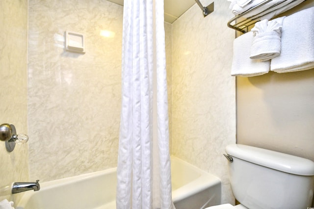 bathroom with shower / bathtub combination with curtain and toilet