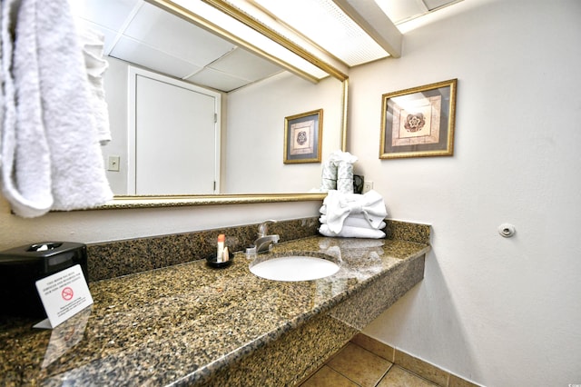 bathroom with tile patterned flooring and a sink