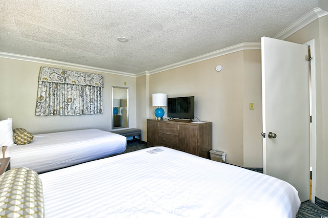 bedroom featuring a textured ceiling and ornamental molding