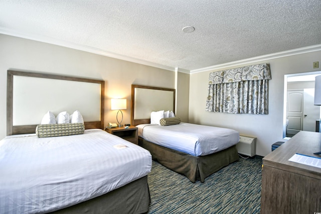 bedroom with ornamental molding, dark carpet, and a textured ceiling