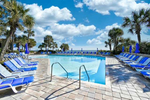 community pool with a patio area